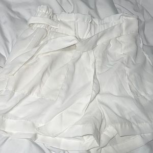 Tie waist white shorts size medium never worn. Tags still on